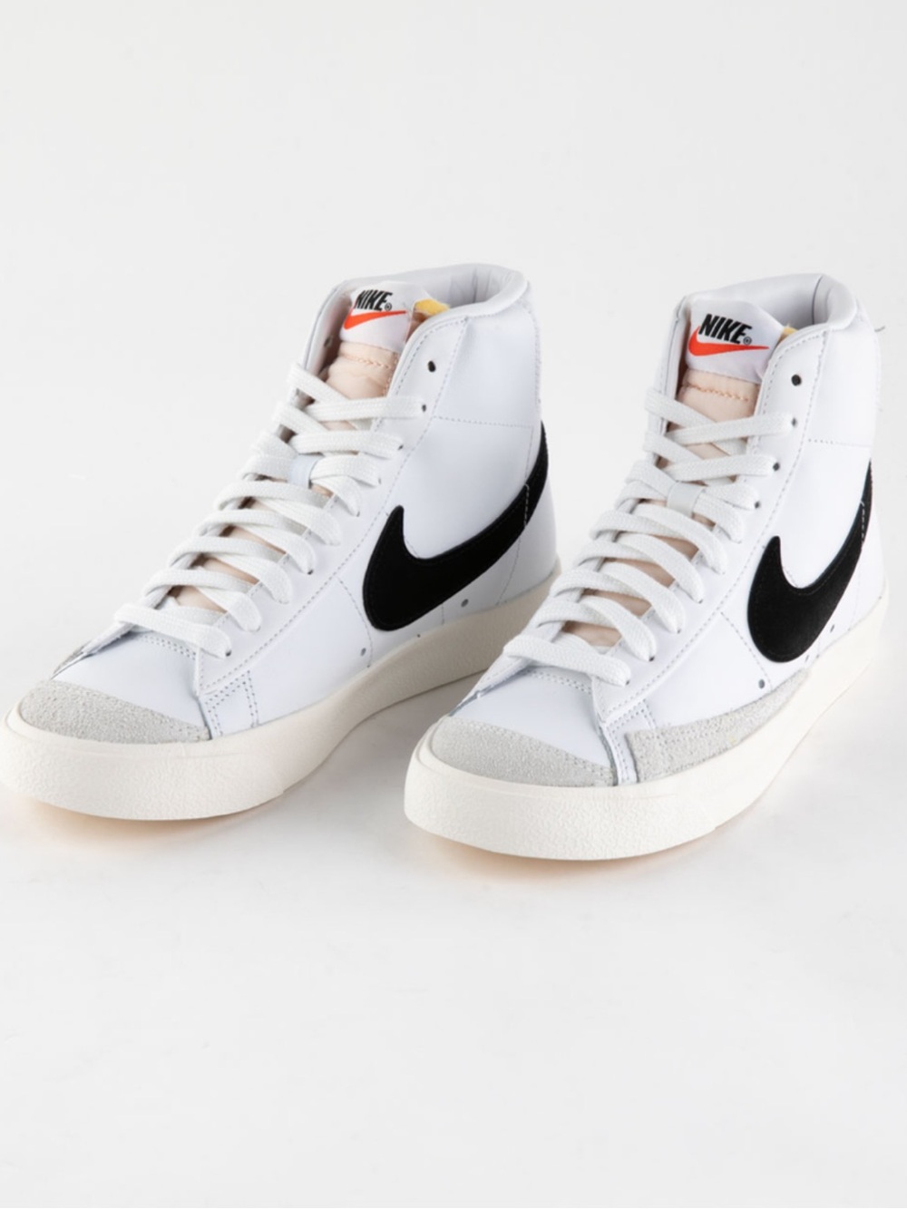 Nike White High-Top Sneakers with Black Swoosh